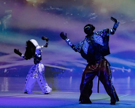 Humanoid robots perform K-pop dancing on a stage