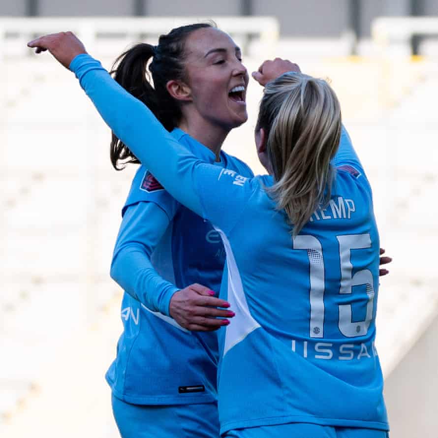 Manchester City's Caroline Weir (left) celebrates her team's third goal with team mate Lauren Hemp.