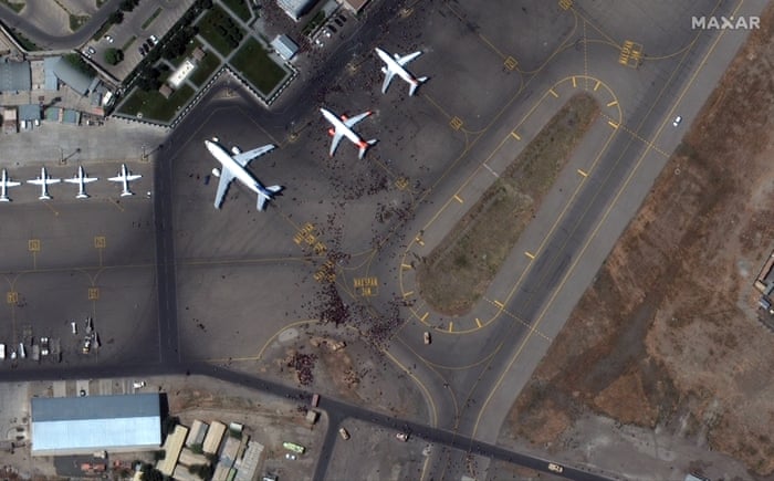 Satellite imagery caught Afghans crowding around planes on the tarmac at Kablu airport