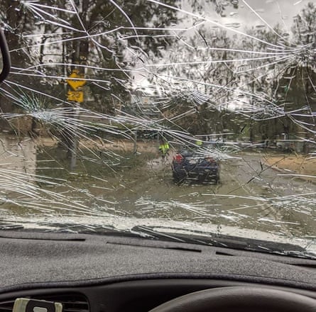 A car windshield is smashed by hail in Canberra