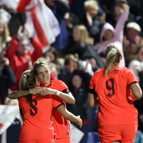 Rachel Daly celebrates after opening the scoring with her England team-mates Georgia Stanway and Alessia Russo.