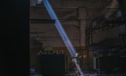 A Ukrainian soldier inside the ruined Azovstal steel plant stands under a sunlight ray in his shelter in Mariupol, Ukraine, 7 May 2022. 