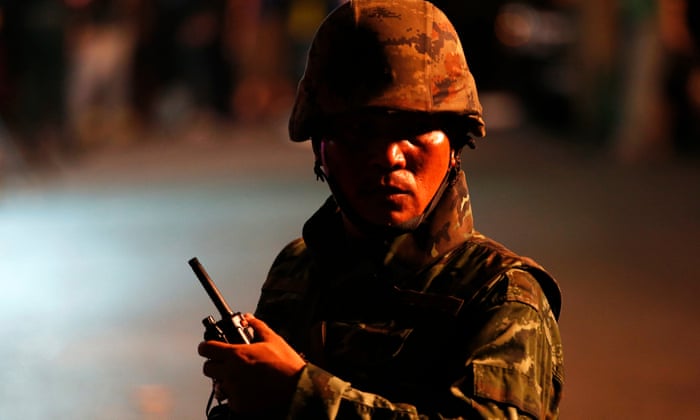 A Thai soldier secures the area after an explosion outside the Erawan shrine, which is popular with tourists