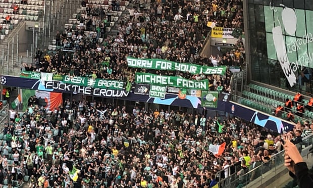 Celtic fans display anti-monarchy banners at the match in Warsaw.