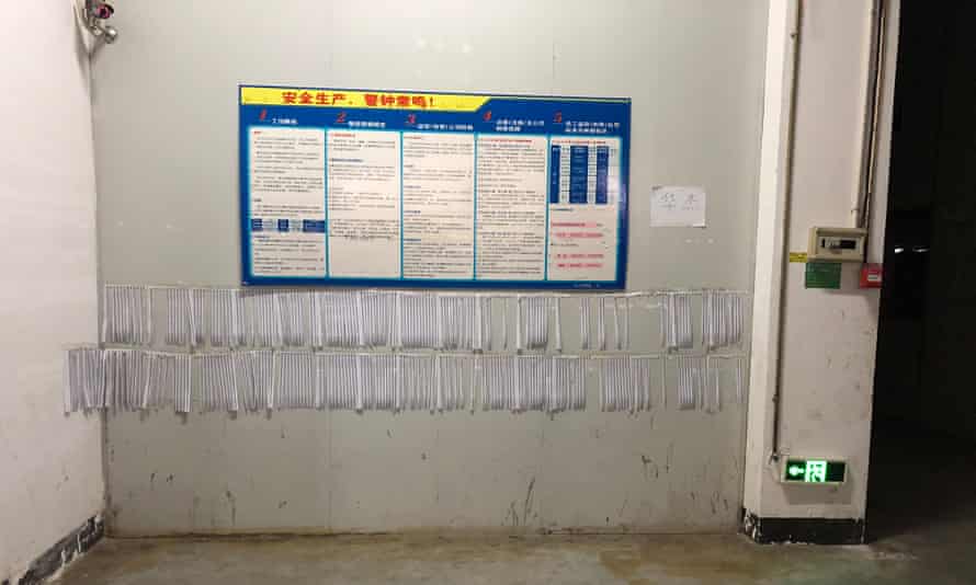 Wage slips pinned to the walls inside the Foxconn factory, Hengyang.
