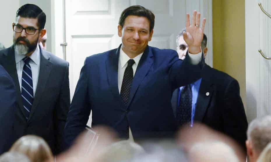 Florida governor Ron DeSantis waves as he arrives to signs a record $109.9bn state budget on 2 June.