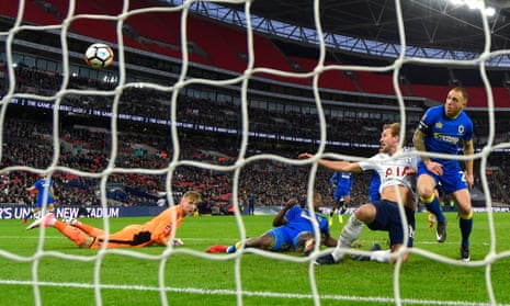 Harry Kane scores Tottenham’s first goal in their 3-0 FA Cup win against AFC Wimbledon at Wembley on Sunday.