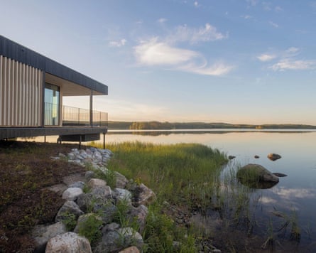 View of a cabin and a lake, at dawn, at Sahanlahti Resort in Finland’s lakeland.