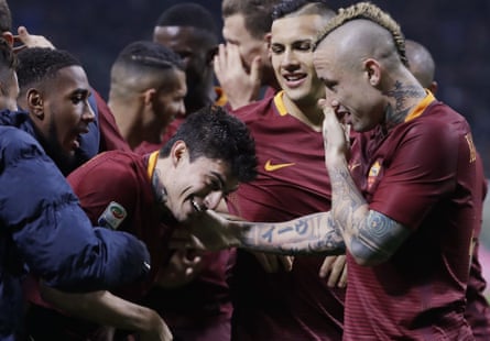 Nainggolan leads the congratulations for Diego Perotti after his penalty.