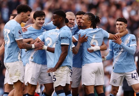 Manchester City celebrate during their 2-1 win over Arsenal on Sunday.