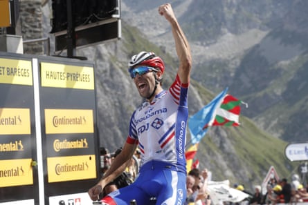 Pinot celebrates as he crosses the finish line to win at the Tourmalet.