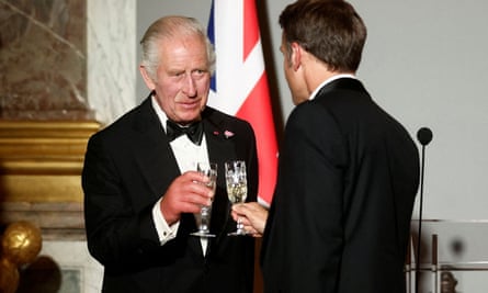 King Charles (left) and French president Emmanuel Macron toast each other at Versailles