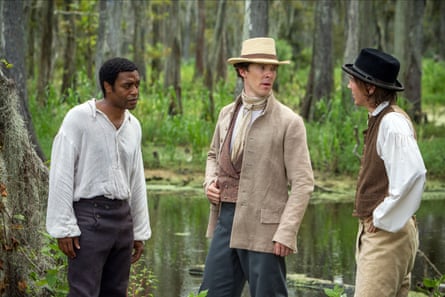 Three men stand by a humid looking swamp in the American south in the mid 1800s.