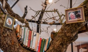 Live birds near a picture of David Attenborough inside Dion’s Library for the Birds of London.