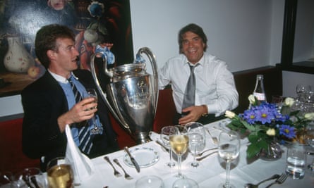 Player Deschamps and president Bernard Tapie hold the European Cup after Marseille won the trophy in 1993.