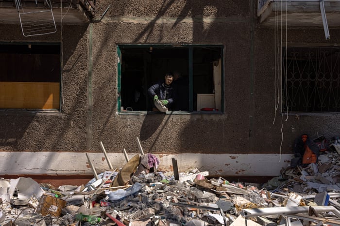 A man cleans his damaged apartment from debris in Kramatorsk, Donetsk region, eastern Ukraine.
