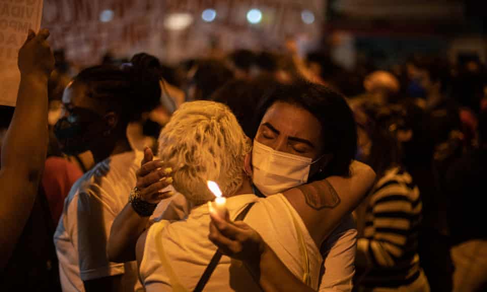 Demonstrators gather and embrace at a protest to denounce the deadliest police operation in Rio history in Jacarezinho. 
