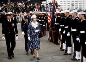 Meticulous attention to detail was a constant in the Queen’s wardrobe while on official business. Visiting San Diego in 1983, she wore a navy skirt suit with a white pattern, a mirror-image colourway on the lapel of the jacket, a blouse and a baker boy style cap. The choice of colour, the hat and white gloves perfectly compliment the sailor suits and military uniforms of the men who surround her in this photo. She looks entirely appropriate, while bringing a little razzle-dazzle to proceedings.