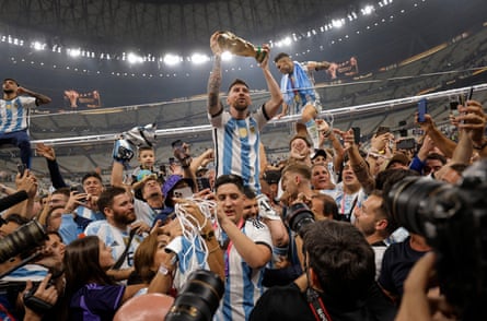 Argentina’s Lionel Messi holds up the World Cup at Lusail Stadium in Doha