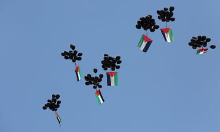 Balloons with Palestinian flags released by protesters in Ramallah, May 2018