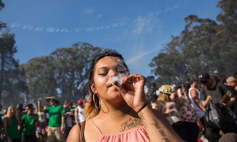 A smoking marijuana in Golden Gate Park in San Francisco, California, celebrating the annual 4/20 festival.