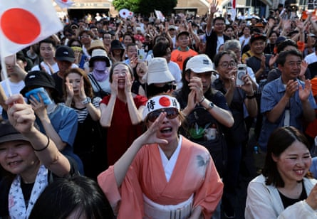 Supporters of Japan’s Sanseito party leader react during the party’s rally in Tokyo in July.
