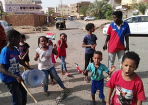 Sudanese children chant slogans in the streets of Khartoum