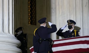 Supreme court honor guard moves the flag-draped casket of justice Ruth Bader Ginsburg back into the court as she lies in repose under the portico at the top of the front steps of the US supreme court building, in Washington.