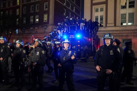 Police use a special vehicle to enter a building