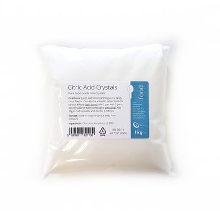 A 1kg clear plastic bag of food-grade citric acid crystals. The bag has a label on the front.