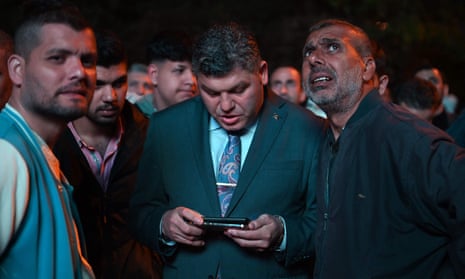 Supporters of President Recep Tayyip Erdogan wait for results outside his AKP party’s HQ in Istanbul