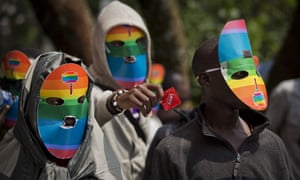 Kenyan protesters wear masks during a rally against Uganda’s laws on LGBT rights.