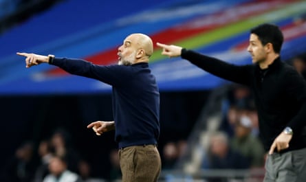 Arsenal manager Mikel Arteta and Manchester City manager Pep Guardiola gesture on the touchline during the Carabao Cup final