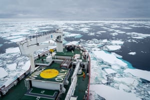 Ship sailing through scattered ice