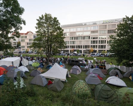 Tents are set up in a small park for a protest camp against Elbit Systems