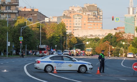 A police officer blocks a road in central Moscow after a drone attack was reported