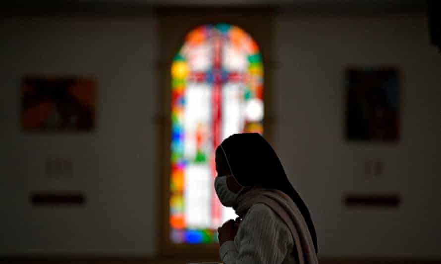 A nun prays during the pilgrimage of the figure of ‘The Fallen Lord of Monserrate’ at the Parish Cathedral Jesus Christ Our Peace in Soacha municipality near Bogota. Due to the lockdown imposed by local authorities in different areas of the Colombian capital, “The Fallen Lord of Monserrate” -which normally remains at the Santuary of the Monserratte mountain- is being taken to different churches in the city from where live transmissions are broadcasted.