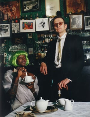 Wojas, wearing a bootlace tie, poses with a member of the club’s bar staff in the late 1990s.