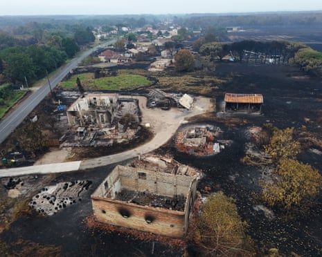 A drone view shows burnt houses in an area affected by wildfire, in Le Porge, Gironde, France.