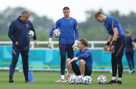 Sam Johnstone, Jordan Pickford and Aaron Ramsdale of England speaking to Martyn Margetson, England goalkeeper coach.