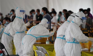 Medical workers swab test people for Covid-19 amid the coronavirus outbreak on 28 June 2020 in Beijing, China.