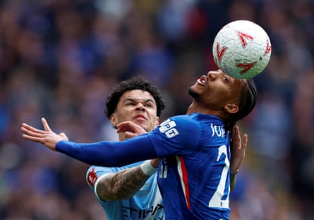 João Pedro jumps for the ball with Manchester City’s Nico O’Reilly.