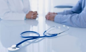 Stethoscope on white desk in doctor's office