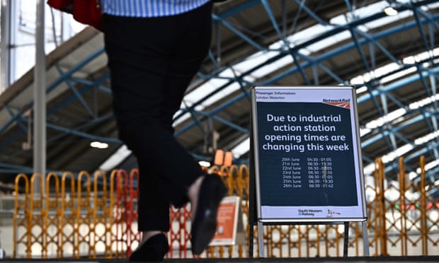 A sign displaying opening times at Waterloo station in London