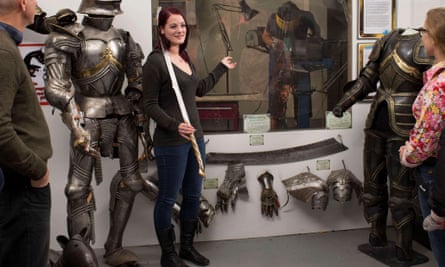 Visitors see props and costumes at the Weta workshop.