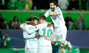 Maximilian Arnold, left, of Wolfsburg celebrates with his team-mates scoring his team’s second goal.