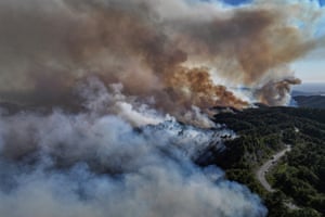Smoke rises during a wildfire