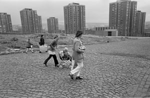 Newcastle upon Tyne, 1972. Families walking across a slum clearance site