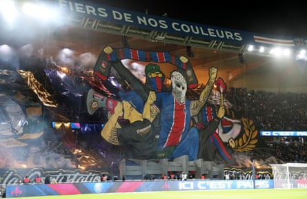 Paris Saint-Germain ultras display a giant banner in the stands at Parc des Princes.