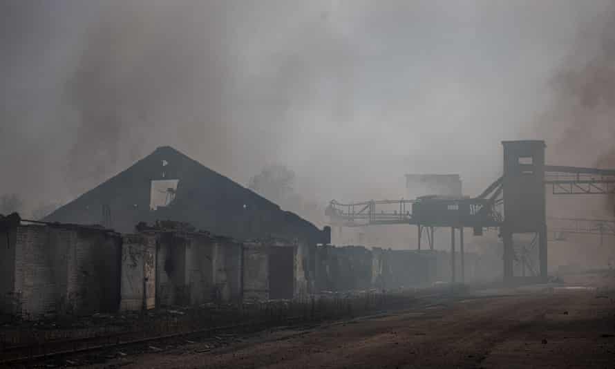 Smoke rising from burning storage buildings containing agricultural products after shelling by Russian forces, in the town of Orikhiv, near Zaporizhzhia, eastern Ukraine.